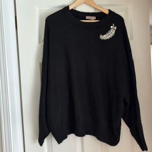 Black embellished sweater.